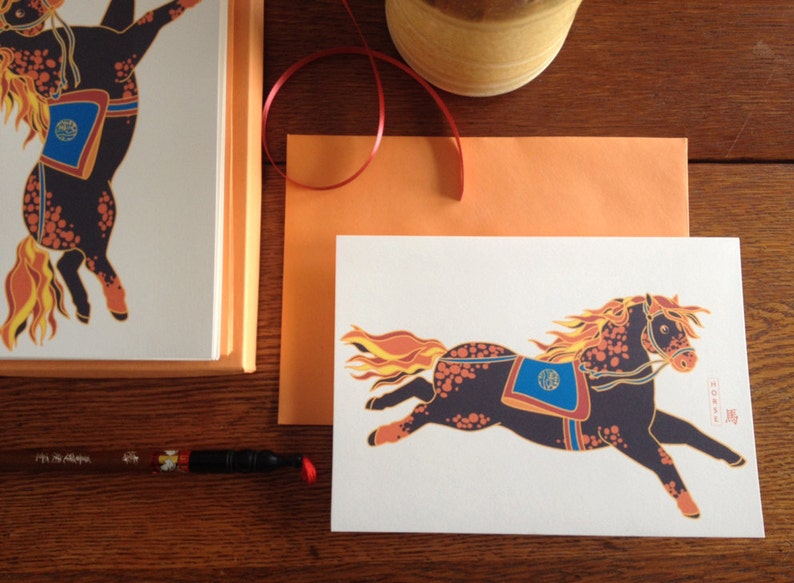 May include: A white card with a colorful illustration of a black horse with orange and yellow flames for a mane and tail. The horse is wearing a blue and orange saddle with a circular design. The card has the text "HORSE" in black lettering in the bottom right corner.