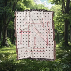 May include: A woven tapestry featuring a red and white word search puzzle. The puzzle includes the words "CHRIST", "LOVE", and "JESUS". The tapestry is displayed against a backdrop of a woodland scene.