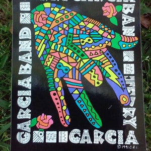 Könnte beinhalten: Schwarz-weißer Aufkleber mit einem farbenfrohen Handdesign und dem Text "Terry Garcia Band" und "Chicago" in einer stilisierten Schrift. Der Aufkleber enthält auch das Copyright-Symbol und das Jahr 1991.