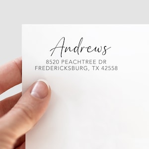 May include: A white return address label with the name "Andrews" written in cursive script. The address is 8520 Peachtree Dr, Fredericksburg, TX 42558.
