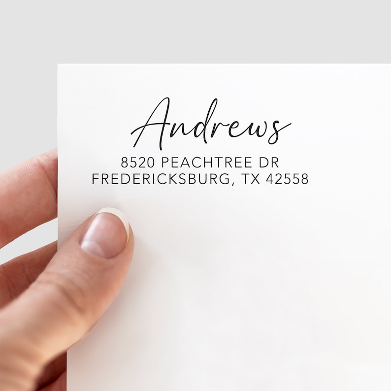 May include: A white return address label with the name "Andrews" written in cursive script. The address is 8520 Peachtree Dr, Fredericksburg, TX 42558.