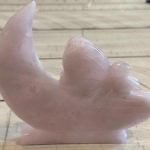 Radiant Rose Quartz Fairy on a Crescent Moon