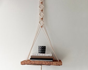 Cork & Cotton macrame floating shelf. Handcrafted plant and book hanging for wall decor using a Portuguese cork board shelf and cork beads.