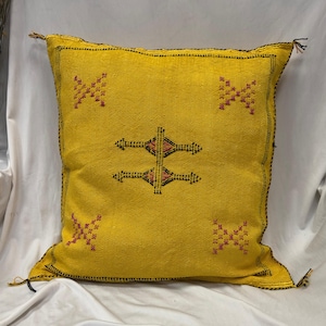 May include: A set of three ceramic mugs with a speckled, matte finish. The mugs are in shades of cream, light gray, and dark gray. Each mug has a simple, minimalist design and a rounded handle.