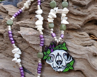 Cat Skull with Catnip - Wooden Pendant - Howlite, Serpentine,  and Glass Bead Necklace - Metaphystical Hand Beaded Purple Vulture Culture