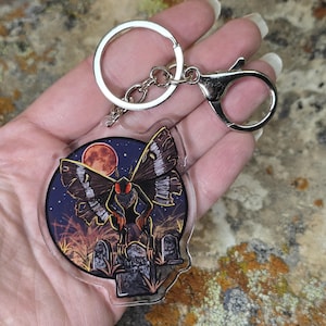 Brelok akrylowy Mothman: upiorny dodatek dla kryptydy