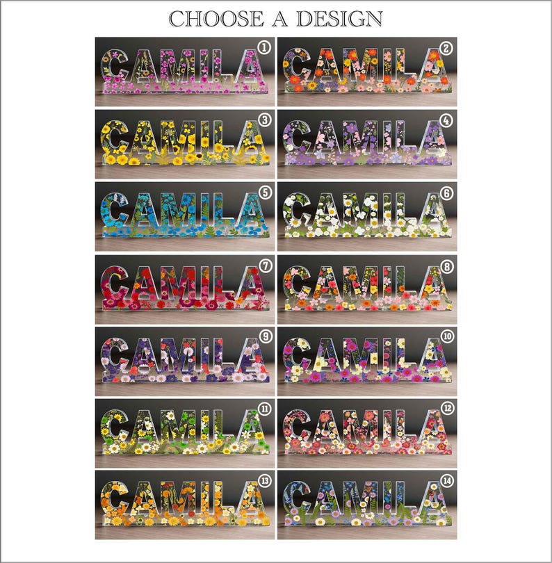 May include: A selection of decorative resin name signs spelling "CAMILA", each filled with colorful flowers. The signs are in various colors and floral arrangements, with the text "CHOOSE A DESIGN" at the top.
