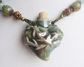 Peruvian clay sacred heart bottle necklace for lotions, potions, herbs, and essential oils