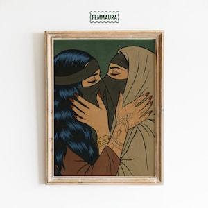 May include: Framed art print featuring two women embracing, their faces partially veiled. One woman has long, dark blue hair and a brown top. The other wears a tan hijab. The artwork has a vintage comic book style. The text "FEMMAURA" is at the top.