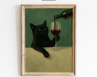 May include: Framed art print featuring a black cat holding a wine glass as wine is poured from a bottle. The cat has green eyes and a slightly annoyed expression. The background is a muted green, and the print is in a wooden frame. The text "FEMMAURA" is at the top.