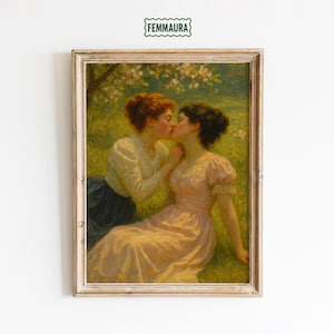 May include: Framed vintage artwork depicting two women kissing in a field. One woman wears a light pink dress, the other a cream-colored blouse and dark skirt. The painting has a soft, romantic feel with a green and yellow background.