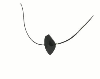May include: A black eye patch with a diamond-shaped patch and a black elastic strap.