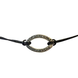 May include: A black leather cord bracelet with a silver oval charm that reads "Love is Patient, Love is Kind".