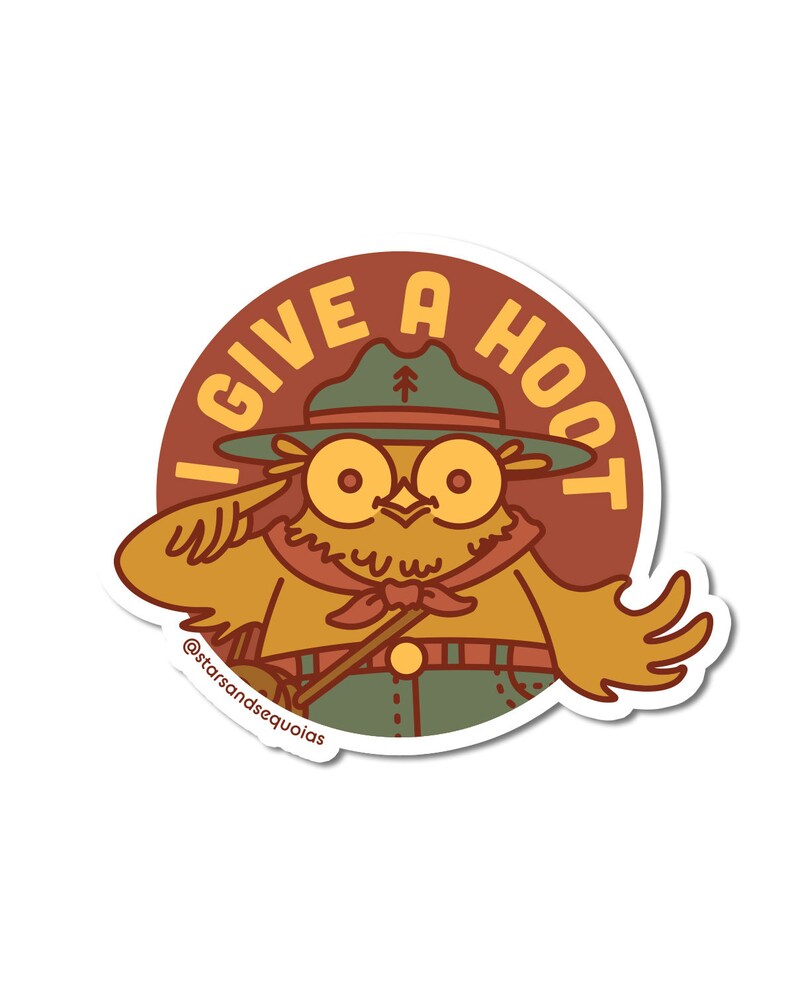 May include: A sticker featuring a cartoon owl in a ranger hat, saluting. The owl is wearing a green hat and uniform, with a red neckerchief. The text "I GIVE A HOOT" is in a circle around the owl. The sticker has a white border.