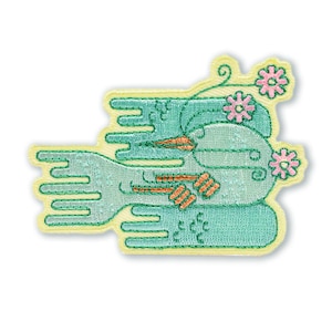 May include: Embroidered patch featuring a whimsical design in shades of teal, orange, and pink. The patch has a light yellow border and depicts a stylized floral and abstract design. The patch is likely for clothing or accessories.