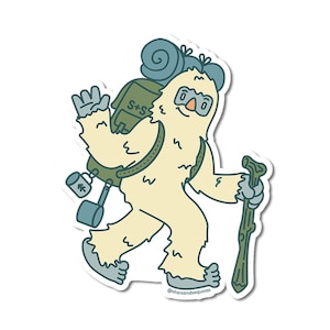 May include: A sticker featuring a cartoon yeti with a backpack, walking stick, and a friendly wave. The yeti is cream-colored with blue and green accents. The backpack has the text "S+S". The sticker has the text "@starsandsequoias".