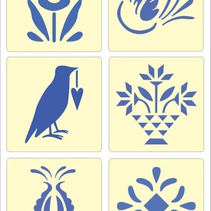 May include: A set of six square stencils featuring blue designs on a pale yellow background. The patterns include a tulip, a bird in flight, a bird holding a heart, a flower basket, a stylized floral bud, and a geometric star-like floral motif.