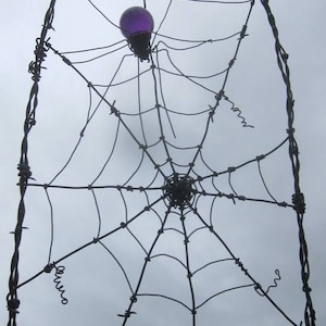 Gorgeous Purple Spider In A Tattered Web Barbed Wire Garden Trellis