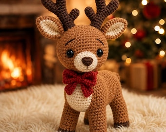 May include: A crocheted reindeer toy featuring a light brown body, dark brown antlers, and a cream-colored muzzle and chest. The reindeer has black safety eyes, a dark brown nose, and a bright red crocheted bow tie around its neck.