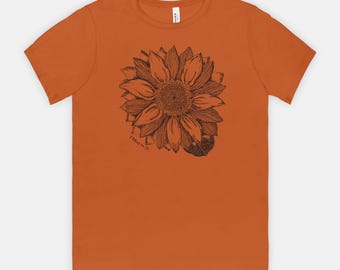 Girasol 1 Pedro 1:24-25 - Camiseta de estilo suave