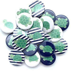 May include: A collection of 1.5 inch button pins featuring a green turtle design on a white background with blue and white stripes, and a green turtle design on a navy blue background.