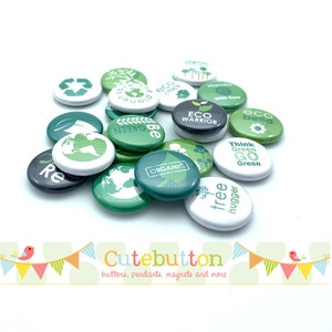 May include: A collection of green and white round buttons with eco-friendly messages, such as "Eco Warrior", "Think Green Go Green", and "Tree Hugger".