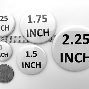 May include: Five white round buttons with black text. The buttons are 1 inch, 1.25 inches, 1.5 inches, 1.75 inches, and 2.25 inches in diameter.