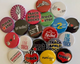 May include: A collection of 16 colorful round buttons with various track and field themed designs. The buttons feature phrases like "track star", "live run live", "track & field rocks", and "got hurdles?"