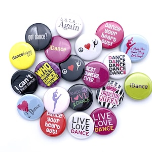 May include: A collection of colorful round buttons with various dance-themed designs and text, including "Dance your heart out!" and "Live Love Dance".