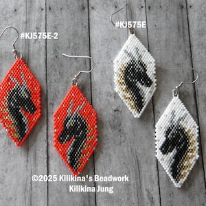 May include: Handmade beaded earrings in a diamond shape. One pair is red with a black horse design, the other is white with a black horse design. Both pairs have silver-colored ear wires. The earrings are displayed on a wooden surface.