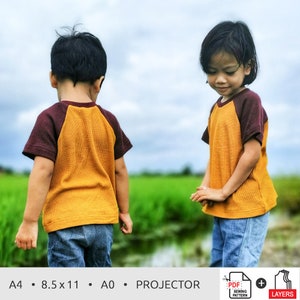May include: Two children wearing yellow and brown raglan t-shirts stand in a field. The t-shirts have a brown raglan sleeve and a yellow body. The children are wearing blue jeans. The image includes the text "A4 • 8.5 x 11 • A0 • PROJECTOR".