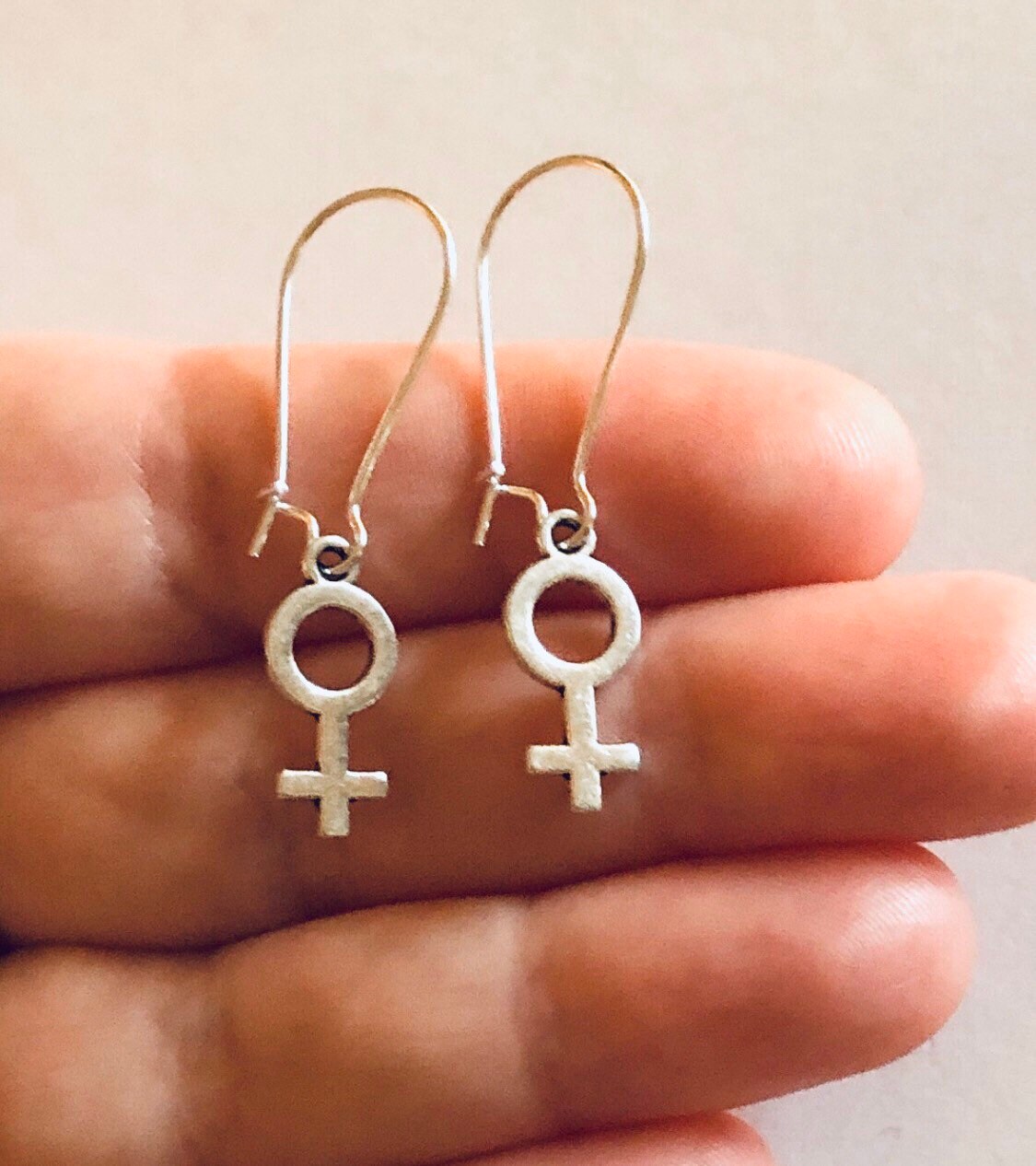 Female gender symbol earrings clearance