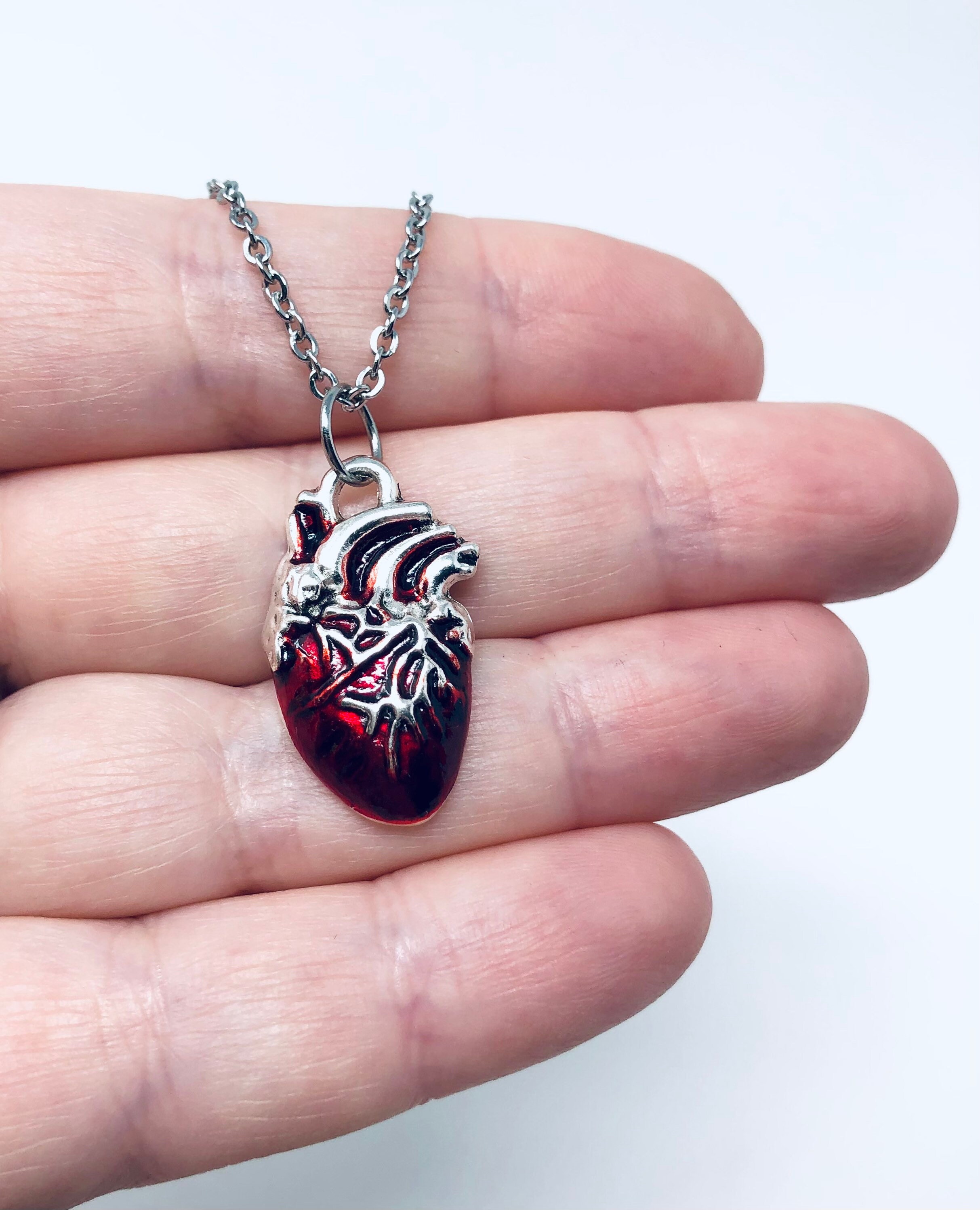 Human heart pendant deals