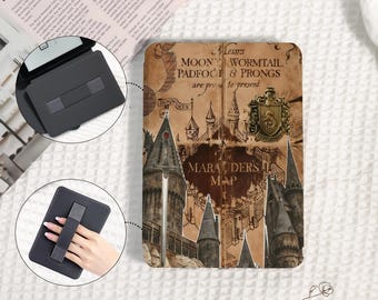 May include: A black tablet case with a hand strap, featuring a vintage map design with text that reads "Messrs MOON, WORMTAIL, PADFOOT & PRONGS are proud to present MARAUDERS MAP". The case has a castle illustration.