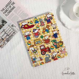 May include: A yellow and white checkered tablet case featuring cartoon mice in various outfits and activities. The case has a variety of colorful illustrations, including mice driving a tractor, playing instruments, and riding in a boat.