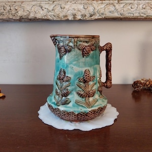 19th century slip pitcher with fir cone decoration, antique ceramic carafe