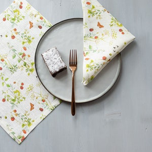 Napkins set. Dinning napkins with wide edge and mitered corners, linen napkins with strawberry and butterfly print