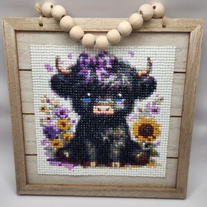 Adorable baby cow diamond art photo with flowers.