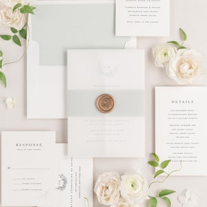 May include: A wedding invitation suite with a white background and a light blue envelope. The invitation features a floral design and a wax seal. The RSVP card has a floral design and the text "Response" and "Reply by April Eighth". The reception card has the text "Reception" and the details of the reception. The details card has the text "Details" and the details of the wedding.