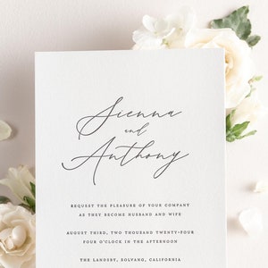 May include: Wedding invitation with white flowers in the background. The invitation reads "Jienne and Anthony" and includes the date and time of the wedding, August 3rd, 2024 at 4:00 PM. The location is The Landsby, Solvang, California. The invitation also states that a reception will follow.