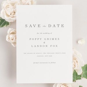 Poppy save the date framed with dreamy florals.