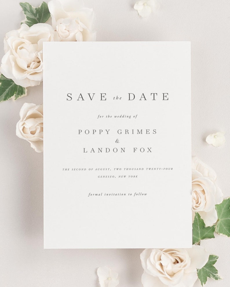 Poppy save the date framed with dreamy florals.
