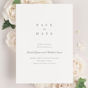 Zarah save the date framed with dreamy florals and greenery.