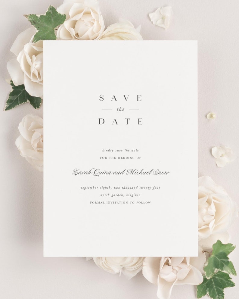 Zarah save the date framed with dreamy florals and greenery.