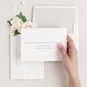 Poppy save the date envelopes with guest addressing, return addressing, and a solid envelope liner.