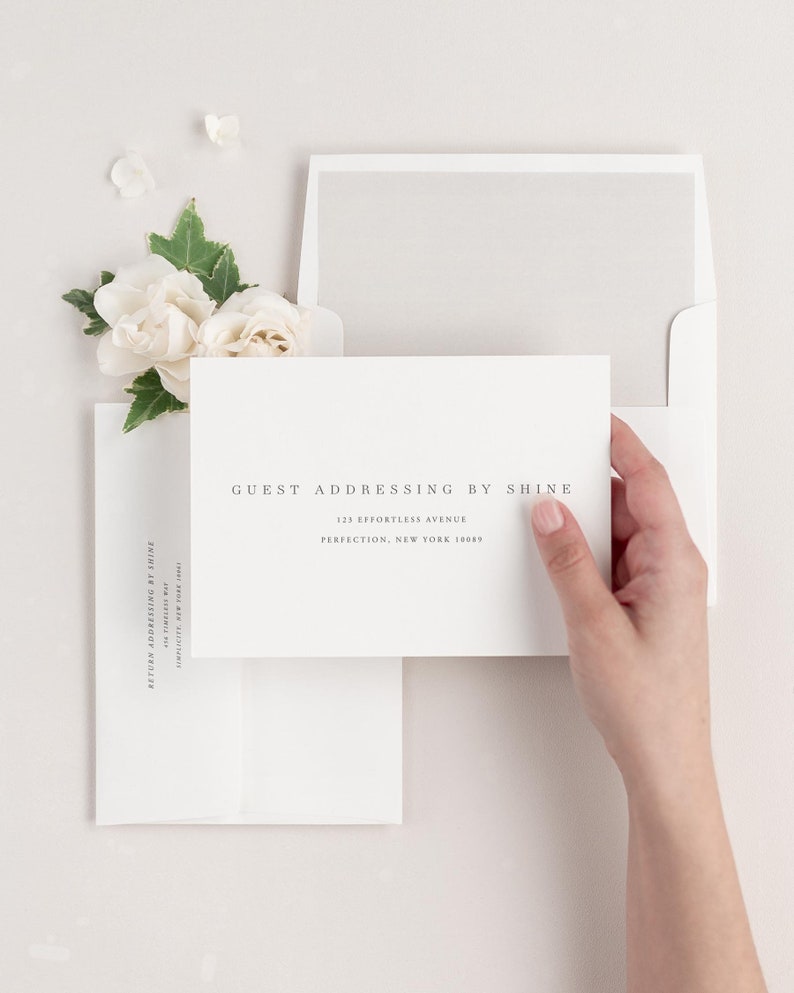 Poppy save the date envelopes with guest addressing, return addressing, and a solid envelope liner.