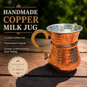 May include: Handmade copper milk jug with a hammered finish. The jug has a gold-colored handle and a silver-colored interior. The text on the image says "Handmade Copper Milk Jug" and "Handmade in Turkey".