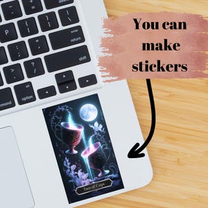 May include: A rectangular sticker featuring a Two of Cups tarot card illustration with two ornate chalices, glowing blue and pink light, and a full moon, applied to a laptop. The text "You can make stickers" is displayed in a pink brush stroke box.