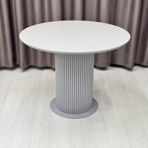 Extendable Round Dining Table: White Fluted Base, Marble HPL Top