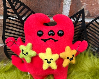 Crafty Devil! Soft red fleece imp companion with star garland